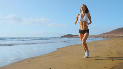 woman-athlete-silhouette-running-on-beach-sprinting-waves-crashing-on-seaside-morning-background-.SLOW-MOTION-STEADICAM.